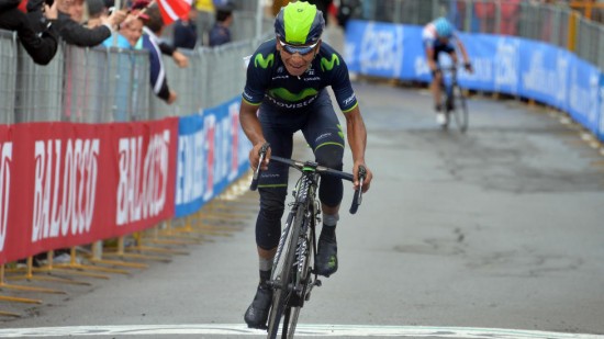 Movistar's Nairo Quintana of Colombia crosses the finish line to win the 16th stage of the Giro d'Italia cycling race from Ponte di Legno to Val Martello, Italy, Tuesday, May 27, 2014. Nairo Quintana moved into the overall lead in the Giro d'Italia after winning a tough and controversial stage, in difficult weather conditions across the legendary Gavia and Stelvio climbs. (AP Photo/Gian Mattia D'Alberto)