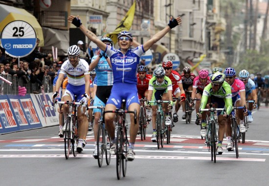 Pozzato of Italy raises his arms as he wins Milan-San Remo cycling race