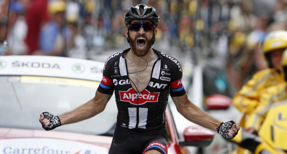 Giant-Alpecin rider Simon Geschke of Germany celebrates as he crosses the finish line to win the 161-km (100 miles) 17th stage of the 102nd Tour de France cycling race from Digne-les-Bains to Pra Loup in the French Alps mountains, France, July 22, 2015. REUTERS/Benoit Tessier