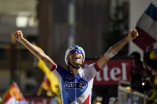 France's Thibaut Pinot celebrates as he crosses the finish line at the end of the 110,5 km twentieth stage of the 102nd edition of the Tour de France cycling race on July 25, 2015, between Modane Valfrejus and Alpe d'Huez, French Alps. AFP PHOTO / ERIC FEFERBERG