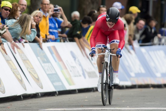 epa04943051 Norway's Truls Engen Korsaeth crosses the finish line in fourth place in the Men's under 23 Individual Time Trial of the 2015 UCI Road World Championships in Richmond, Virginia, USA, 21 September 2015.  EPA/SHAWN THEW