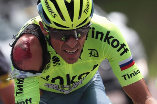 Spain's Alberto Contador is seen injured after a crash during the 188 km first stage of the 103rd edition of the Tour de France cycling race on July 2, 2016 between Mont-Saint-Michel and Utah Beach Sainte-Marie-du-Mont, Normandy. / AFP PHOTO / KENZO TRIBOUILLARD