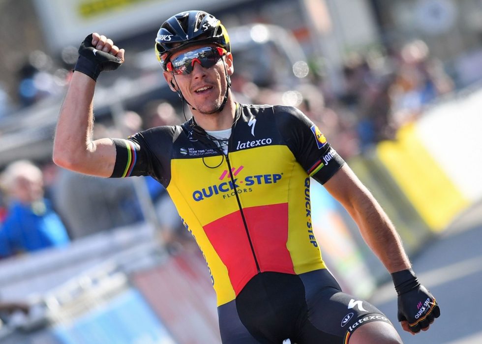 Belgian cyclist Philippe Gilbert of Quick-Step Floors celebrates as he crosses the finish line to win the first stage of the Driedaagse De Panne - Koksijde cycling race