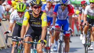KUNNE SMILE: Amund Grøndahl Jansen var meget fornøyd etter at lagkamerat Dylan Groenewegen vant den syvende etappen under Tour de France. Foto: Heiko Junge / NTB scanpix